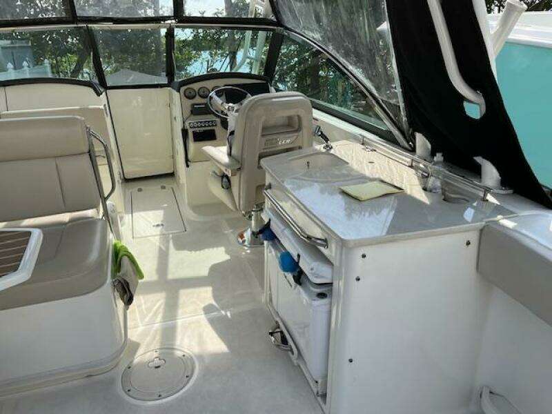 2018 Boston Whaler 270 Vantage boat interior with helm, seating, and storage.