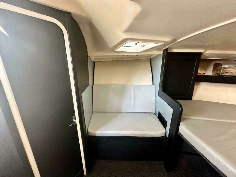 Interior cabin of 2000 Luhrs Tournament 320 Open boat with seating and storage.