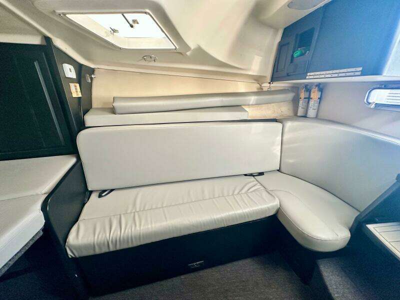 Interior of 2000 Luhrs Tournament 320 Open with white cushioned seating.