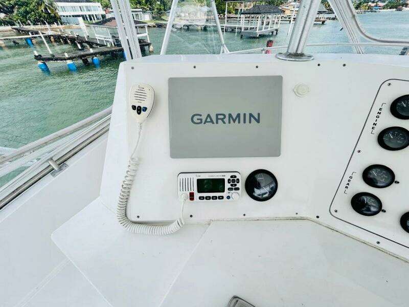 Bertram 54' 1988 yacht helm with Garmin navigation system and radio controls.