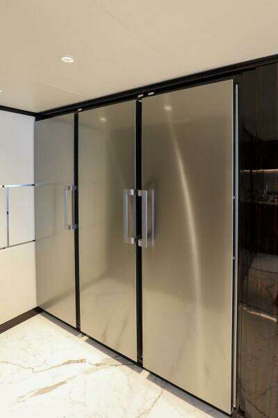 Sleek 2025 Majesty 120 yacht interior with modern stainless steel appliances.