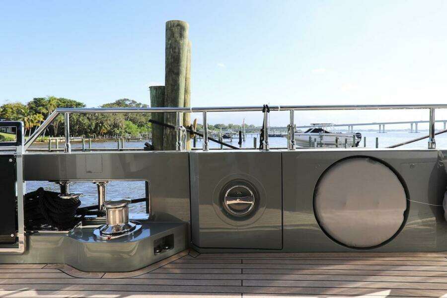 Majesty 120 yacht deck, 2025 model, docked with scenic waterfront view.