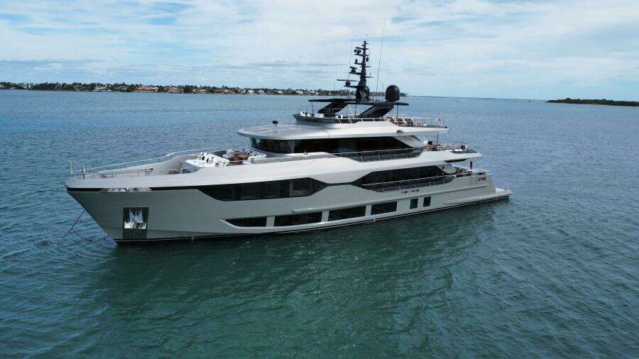 Majesty 120 yacht, 2025 model, cruising on calm blue waters under a clear sky.