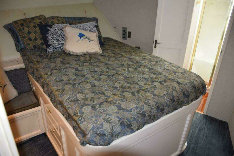 Walkaround Queen Berth With Changing Seats On Either Side Of Berth