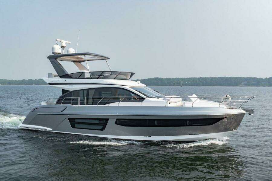 2023 Azimut Fly 53 yacht cruising on open water, side view.