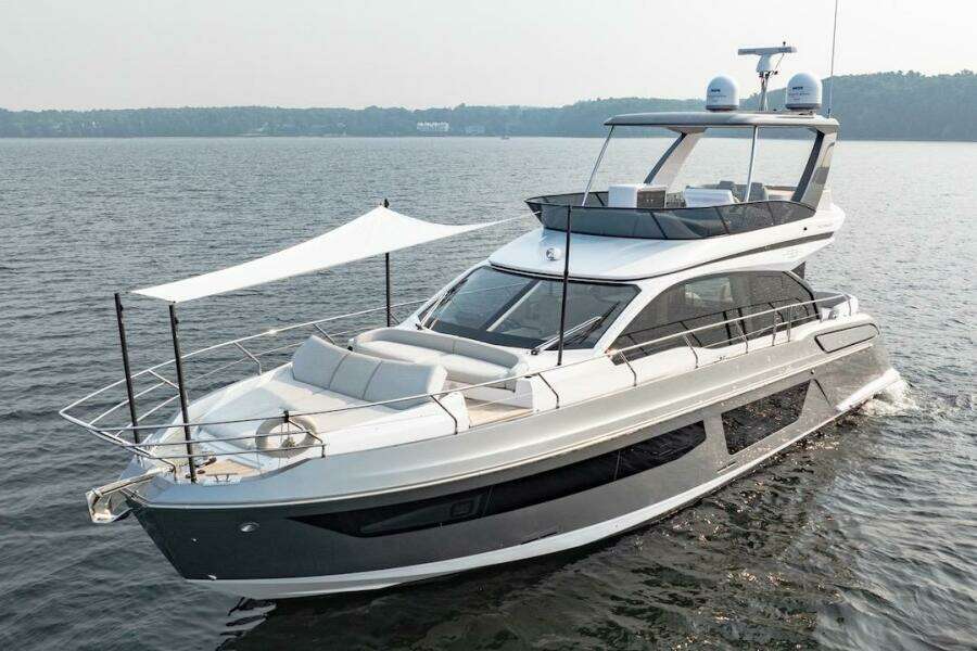 2023 Azimut Fly 53 yacht cruising on a serene lake.
