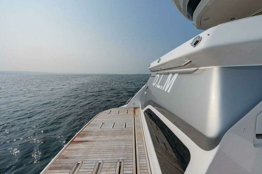 Azimut Fly 53 yacht, 2023 model, with wooden deck overlooking the ocean.