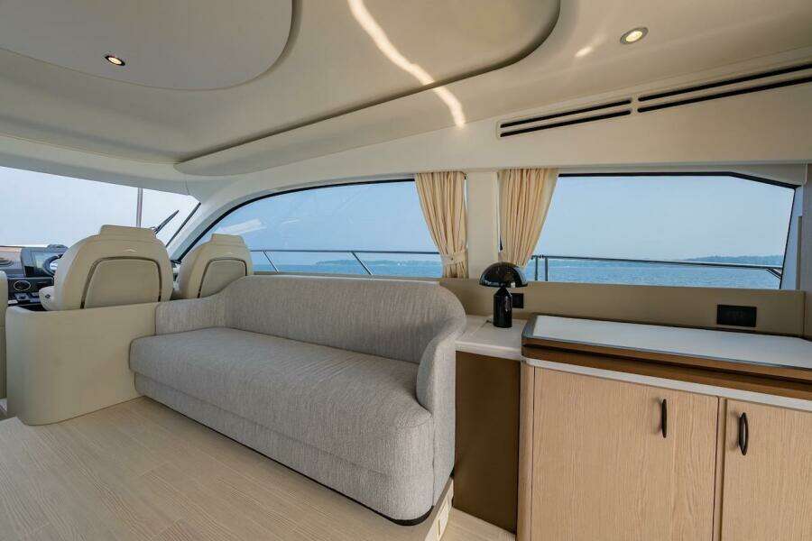 Interior of 2023 Azimut Fly 53 yacht with modern seating and ocean view.