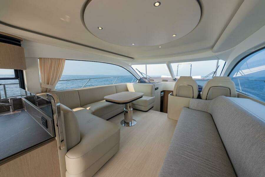 Luxurious interior of 2023 Azimut Fly 53 yacht with elegant seating and ocean view.