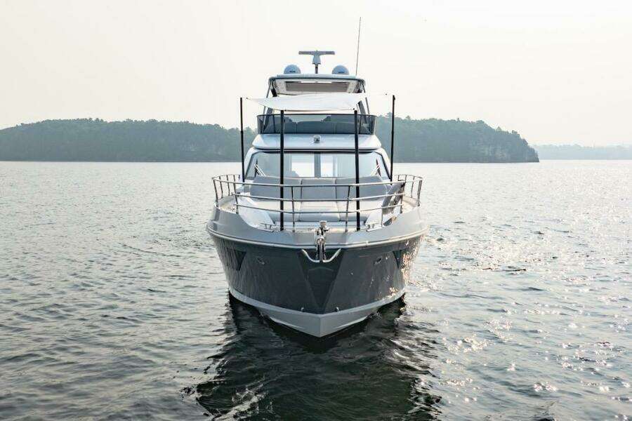 2023 Azimut Fly 53 yacht on calm water with scenic island backdrop.