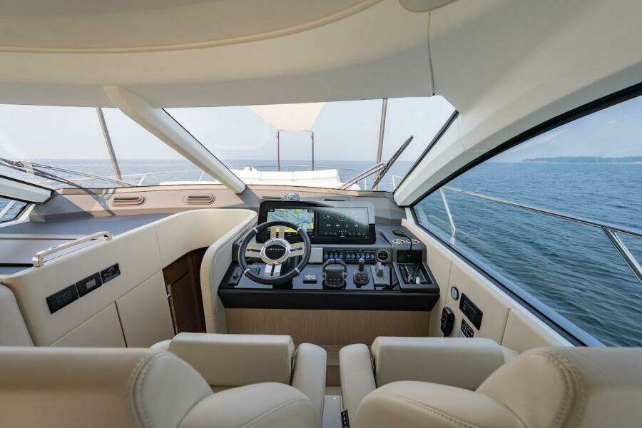 Luxurious interior of 2023 Azimut Fly 53 yacht with modern helm and ocean view.