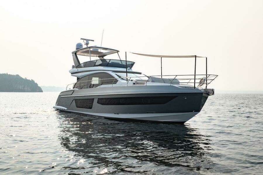 2023 Azimut Fly 53 yacht on calm water, showcasing sleek design and luxury features.