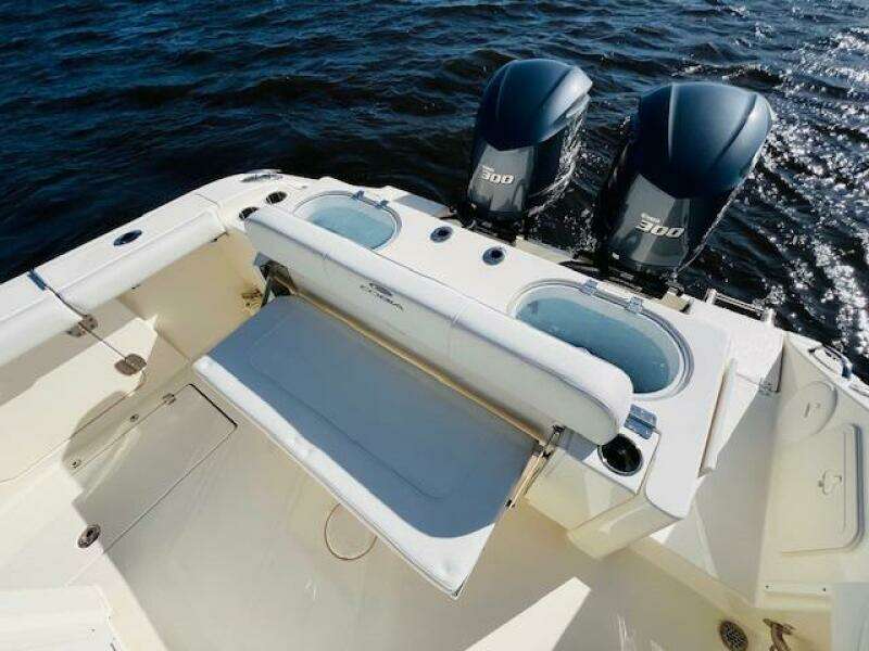 2021 Cobia 301 Center Console boat with twin 300 engines on open water.