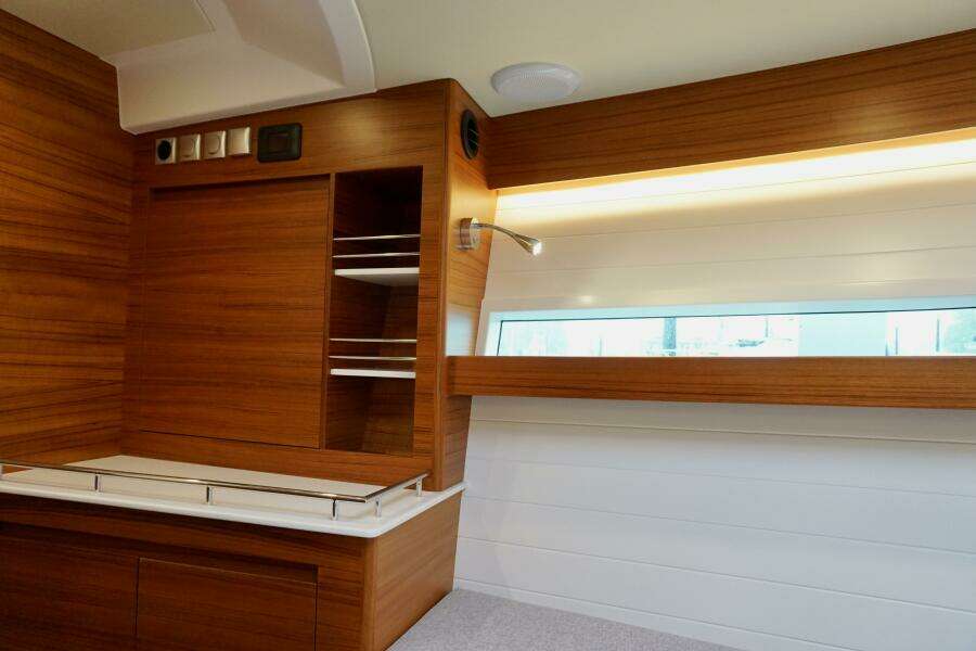 2023 Delta Powerboats 33 Coupe London Calling portside bulkhead storage