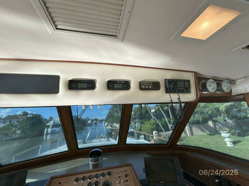 63' Hatteras pilothouse helm overhead electronics
