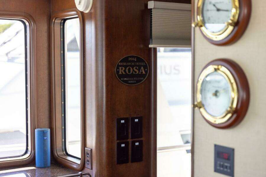 Wooden staircase with ornate railings inside a 1996 ABD 90 Explorer yacht.