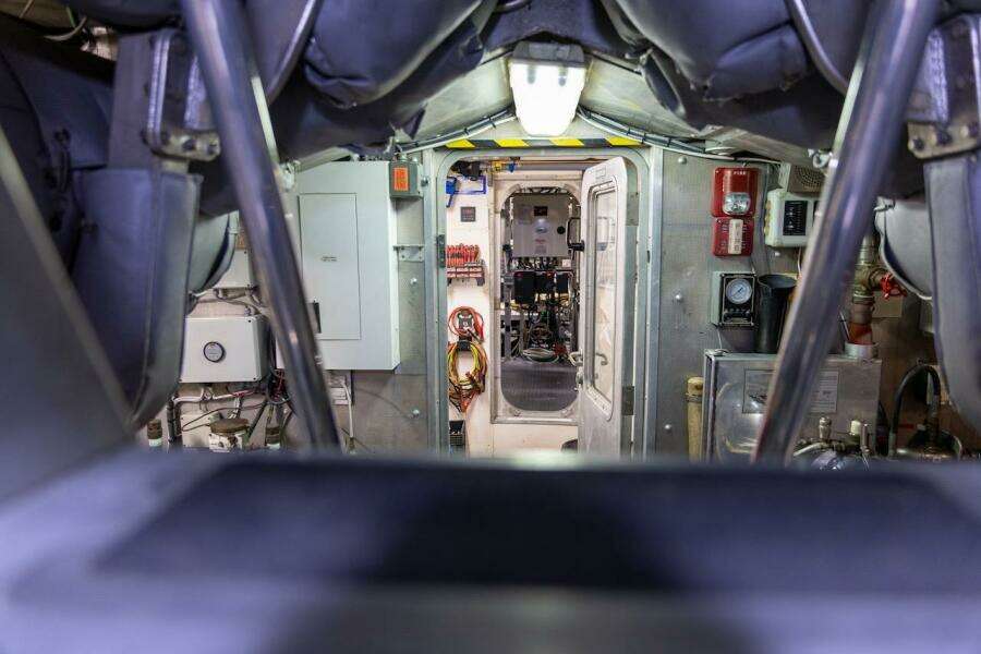 Engine room of 1996 ABD 90 Explorer yacht, featuring control panels and machinery.