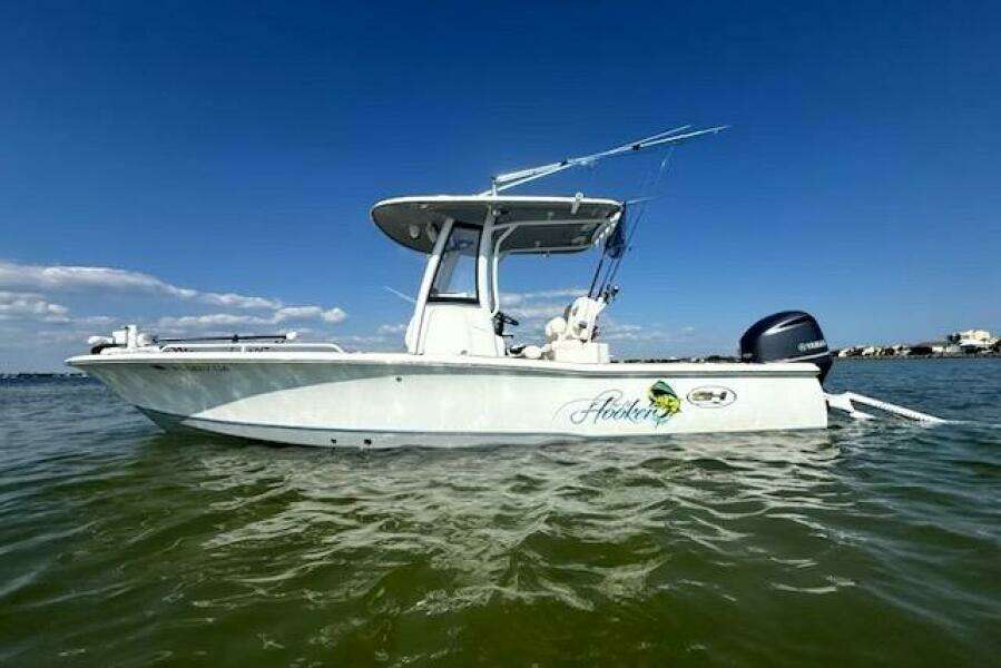 2018 Sea Hunt BX 25 FS boat on water under clear blue sky.