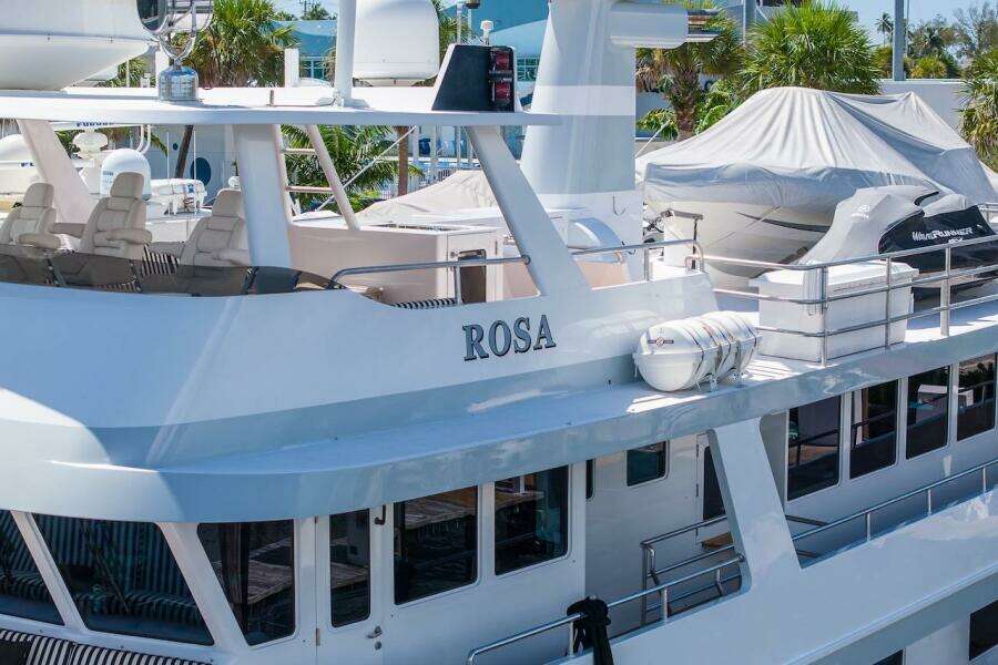 Luxury yacht "ROSA" docked, featuring sleek design and modern amenities, ABD 90 Explorer 1996.