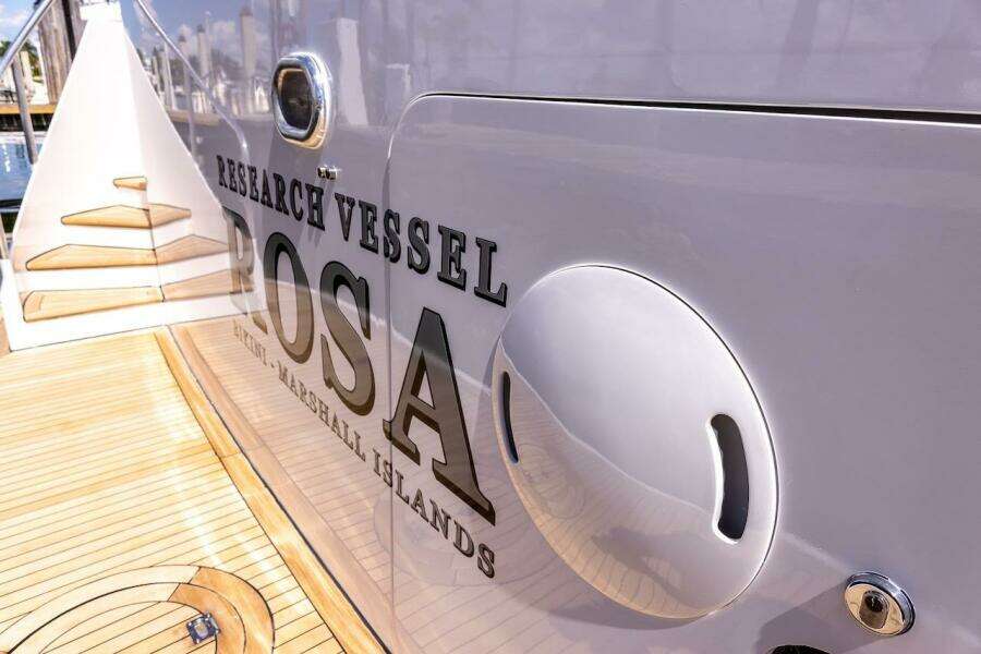 Research vessel "Rosa" docked, featuring wooden deck and sleek design, ABD 90 Explorer 1996.