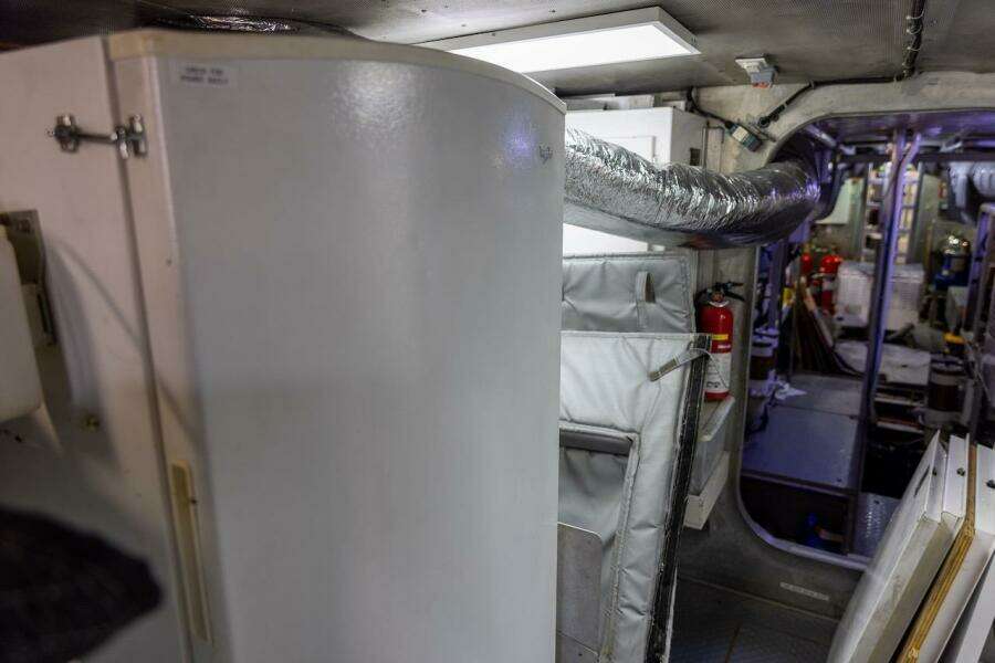 Interior of a 1996 ABD 90 Explorer yacht, featuring equipment and safety gear.