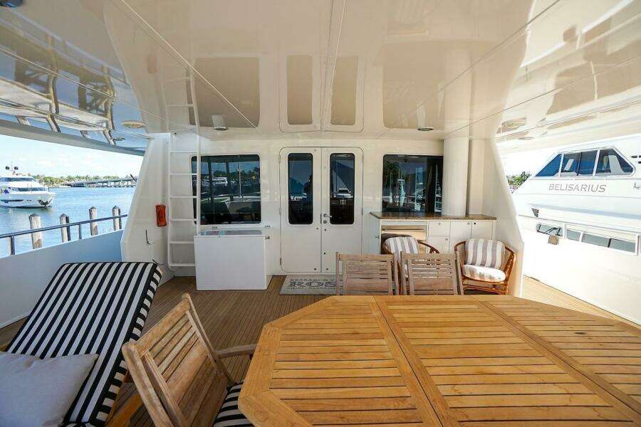 Luxurious wooden office space in 1996 ABD 90 Explorer yacht with printer and chair.