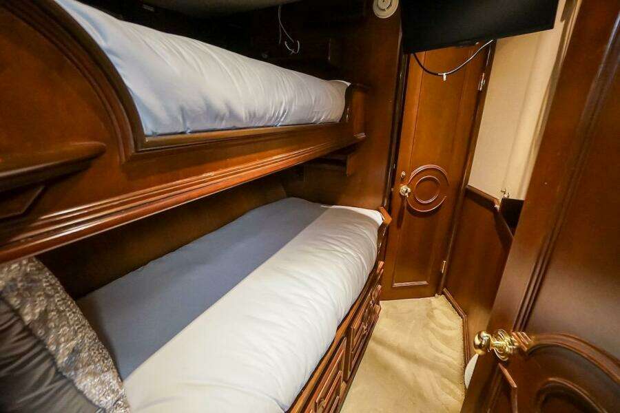 Luxurious wooden bunk beds in 1996 ABD 90 Explorer interior.