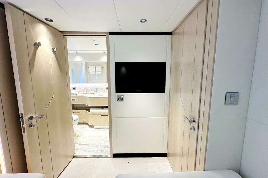 Luxurious interior of 2023 Majesty 120 yacht featuring modern bathroom and sleek design elements.