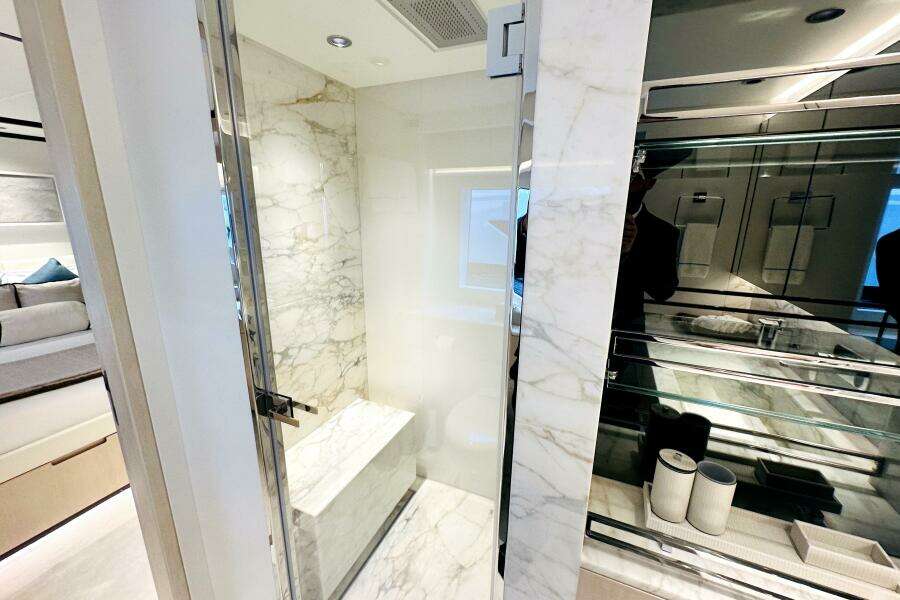 Luxurious marble bathroom interior on 2023 Majesty 120 yacht.