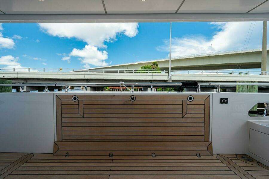 Majesty 140 yacht deck, 2020 model, featuring sleek wood finish and modern design.