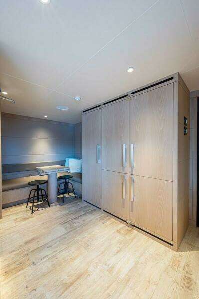 Modern interior of 2020 Majesty 140 yacht with seating and storage.