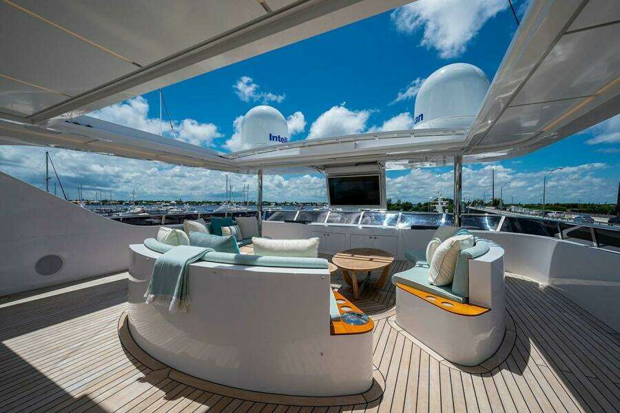 Luxurious 2020 Majesty 140 yacht deck with elegant seating and ocean view.