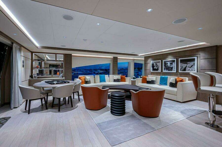 Luxurious interior of 2020 Majesty 140 yacht with modern seating and elegant decor.