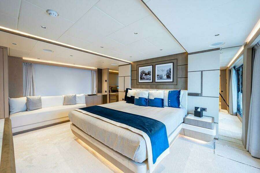 Luxurious bedroom interior on 2020 Majesty 140 yacht, featuring elegant decor and modern amenities.