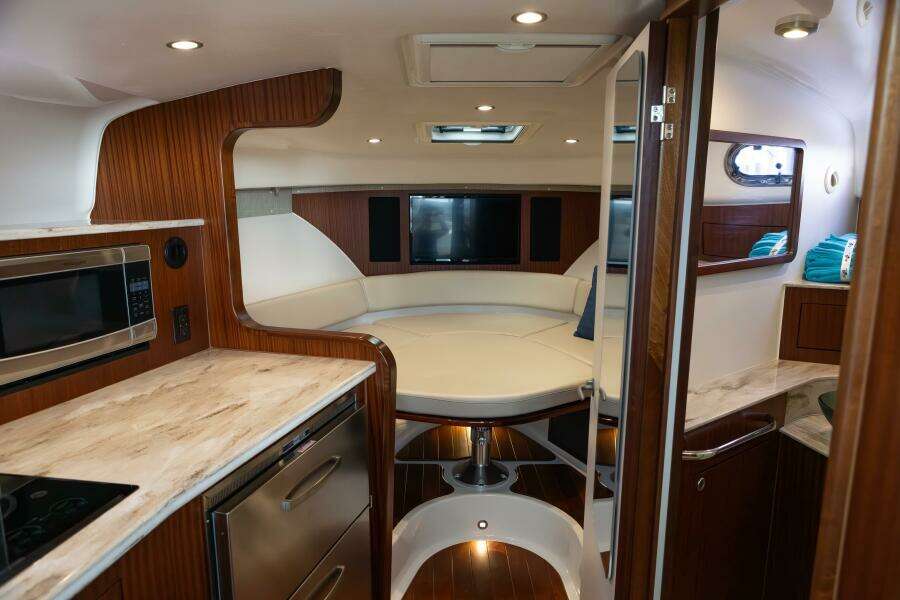Pursuit 38 - TRACKER - Cabin View of Galley, Berth & Head