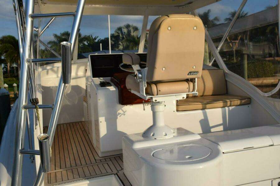 Teak Decking On Bridge Deck And Aft Facing Bench Seat To Right Of Helm.   Copy