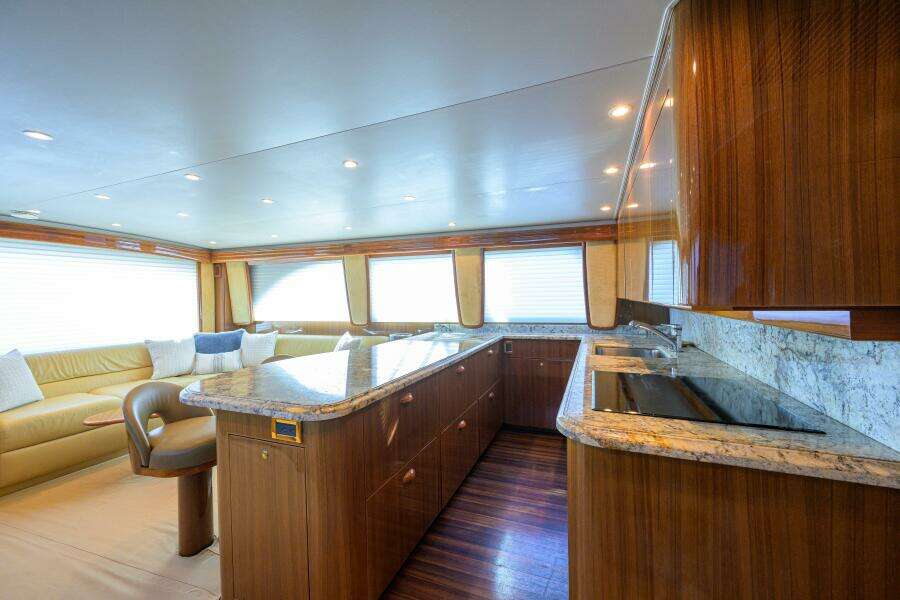 Galley With Rosewood Laminate Flooring And SubZero Drawers
