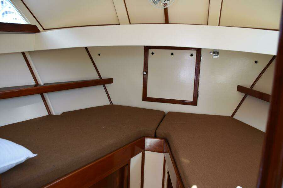 Shelves And Reading Lights In V Berth, Trimmed With Teak In Herreshoff Styling