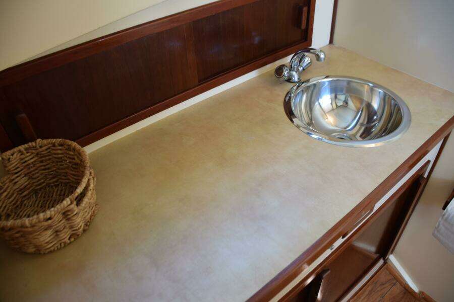 Storage Cabinet With Sliding Door Behind Countertop