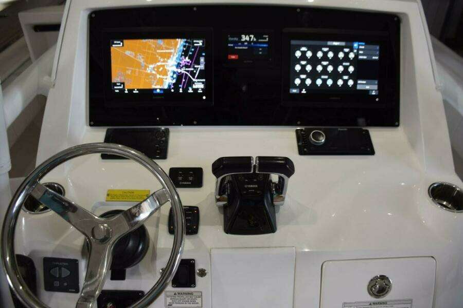 Dual Garmin 12 Inch Displays With Garmin Autopilot Between. Digital Switching For Boat Systems Via Garmin.