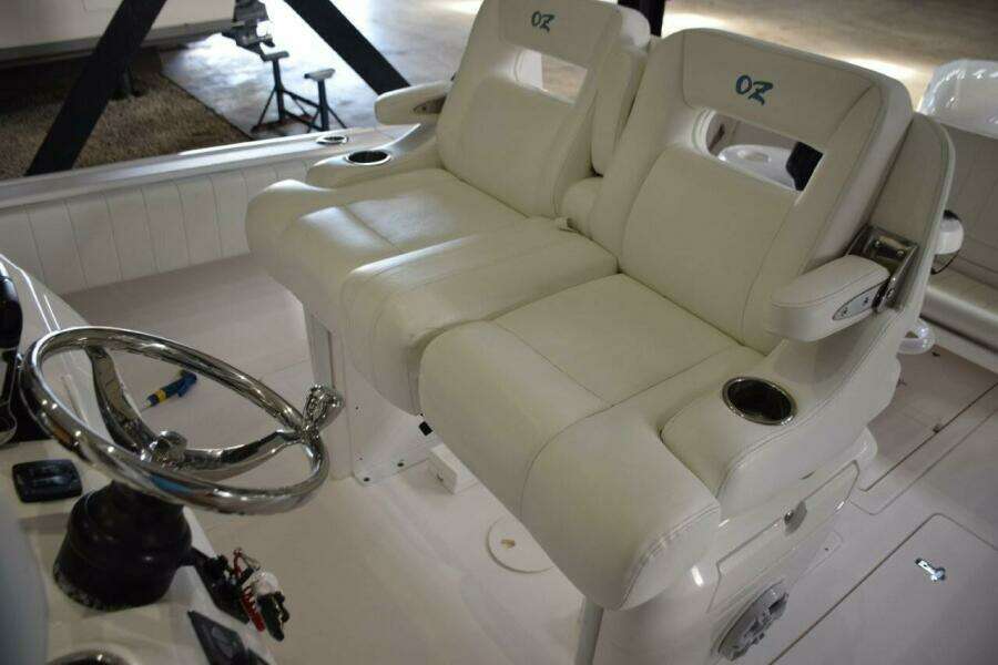 Ocean Elite Helm Seat Console With Fold Down Armrests And Drink Holders.