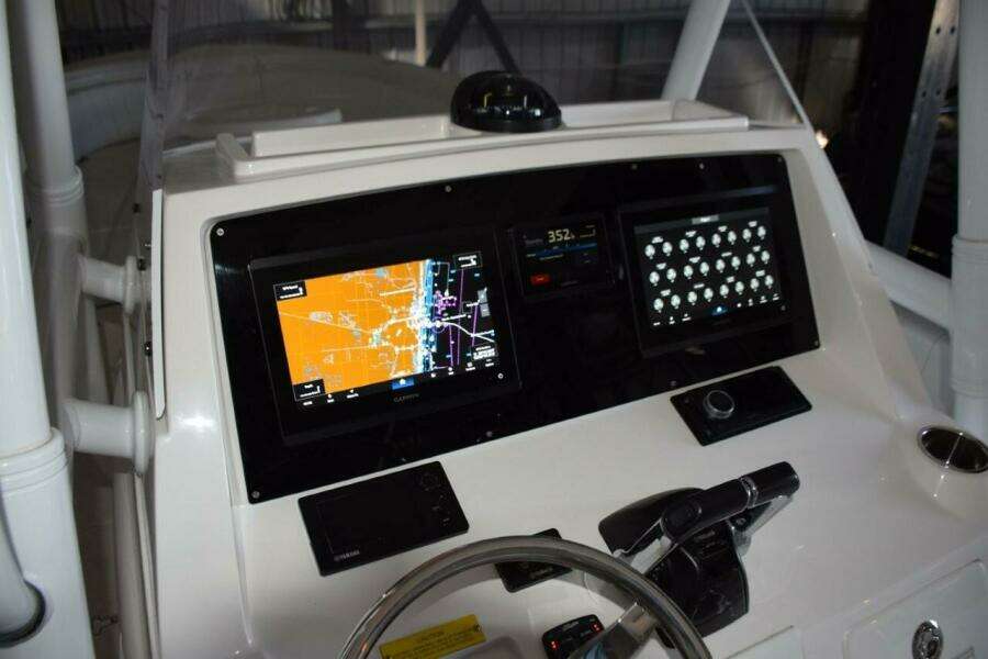 Magnetic Compass On Top Of Helm, Fusion Stereo To Starboard.